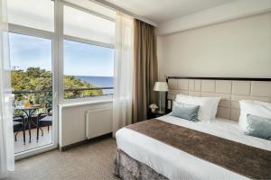 Postel nebo postele na pokoji v ubytování Baltic Beach Hotel & SPA