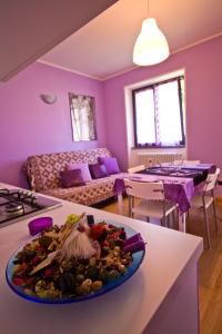 a living room with a plate of food on a counter at Casa Vacanze Zia Vivina B N in Sorico