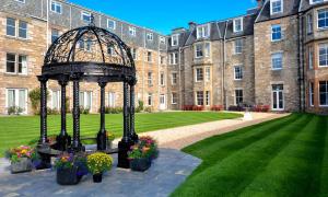 a gazebo in front of a large building at Fisher's Hotel in Pitlochry