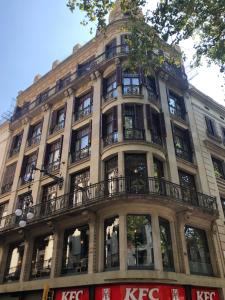 a large building with windows and a balcony at Gòtic by The 5ve Soul in Barcelona