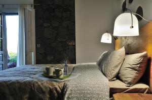 Łóżko lub łóżka w pokoju w obiekcie El Susurro Ecoliving_VILLA PARDELA