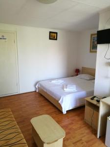 Postel nebo postele na pokoji v ubytování Hotel Dona + 12 fotografií