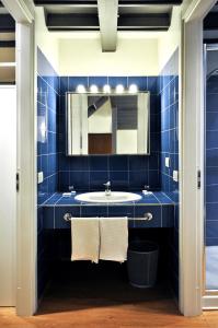 
a bathroom with a sink and a toilet at BB Hotels Aparthotel Città Studi in Milan
