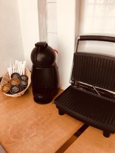 a coffee maker sitting on a table next to a basket of coffee at La casita Santa Bárbara in Macastre +27 photos