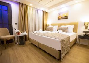 Postel nebo postele na pokoji v ubytování Antusa Design Hotel & Spa