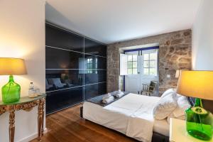 Un pat sau paturi într-o cameră la Eido do Carvalhoso - Casa de Campo em Arcos de Valdevez