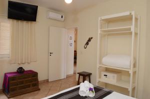 Cama ou camas em um quarto em Pousada Villa Maritima