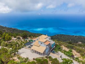 an aerial view of a house with the ocean in the background at Villa Matula in Kalamitsi