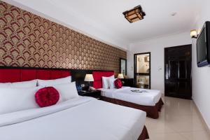 Postel nebo postele na pokoji v ubytování Hanoi Amore Hotel & Travel + 25 fotografií