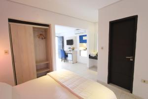 Un ou plusieurs lits dans un hébergement de l'établissement Danieri Asunción Hotel