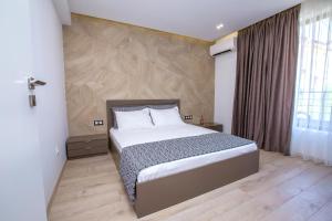 Ένα ή περισσότερα κρεβάτια σε δωμάτιο στο South Place Apartments