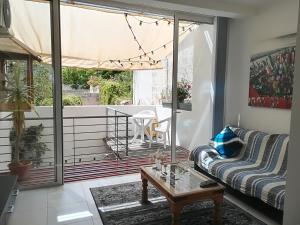 a living room with a couch and a table at Luxury Apartment close to seafront in Sliema