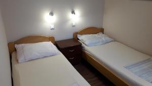 Postel nebo postele na pokoji v ubytování Apartments Svjeta