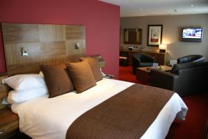 A bed or beds in a room at Beamish Park Hotel