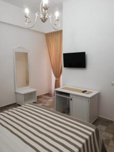 TV a/nebo společenská místnost v ubytování B&B Notte d'autore + 15 fotografií