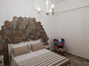 Postel nebo postele na pokoji v ubytování B&B Notte d'autore