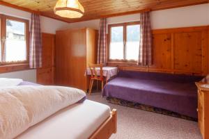 Posteľ alebo postele v izbe v ubytovaní Haus Waldheim