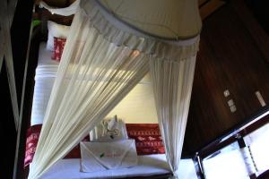Letto o letti in una camera di Turtle Beach Hotel