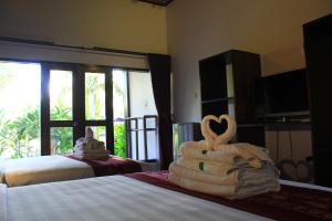 Letto o letti in una camera di Turtle Beach Hotel