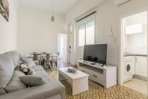 A television and/or entertainment centre at AoA San Lorenzo Apartment