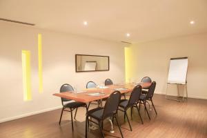 a conference room with a table and chairs at Dazzler by Wyndham Buenos Aires Recoleta in Buenos Aires +106 photos