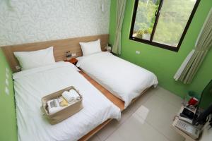 Postel nebo postele na pokoji v ubytování Mayu Hotel