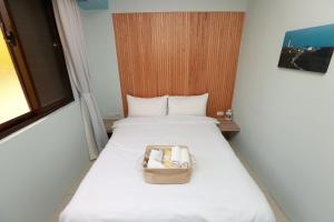Postel nebo postele na pokoji v ubytování Mayu Hotel