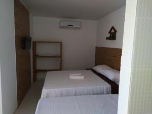 Postel nebo postele na pokoji v ubytování Recanto das Folhas