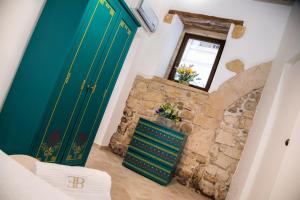 Posteľ alebo postele v izbe v ubytovaní Ortigia Ancient House