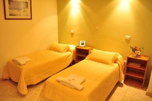 Una cama o camas en una habitación de Hotel Brunetti