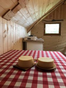 a room with two chairs sitting on a table at Suška Koča in Stahovica