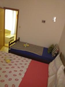 Postel nebo postele na pokoji v ubytování Apartment Onix