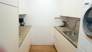 Kuchyňa alebo kuchynka v ubytovaní Loft #11 mit großer Loggia und Terrasse