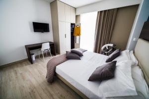 Postel nebo postele na pokoji v ubytování Vignadonica Resort