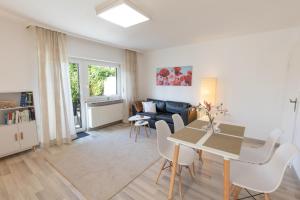 a living room with a table and a couch at Ferienhaus Ko-Living in Koblenz