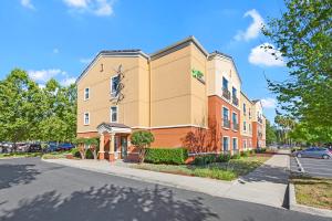 a large building with a clock on the front of it at Extended Stay America Suites - San Ramon - Bishop Ranch - East in San Ramon
