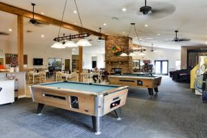 a room with two ping pong tables in it at Hideaway at Holiday Hills in Branson