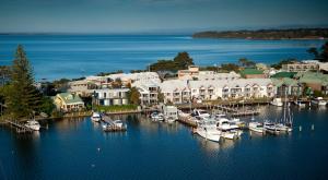 an aerial view of a marina with boats in the water at The Moorings at Metung in Metung