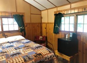 Postel nebo postele na pokoji v ubytování Bill Cody Ranch