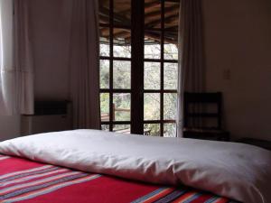 Postel nebo postele na pokoji v ubytování Manantial Hostería & Cabañas + 37 fotografií