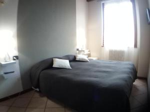 Posteľ alebo postele v izbe v ubytovaní Appartamento Luisa