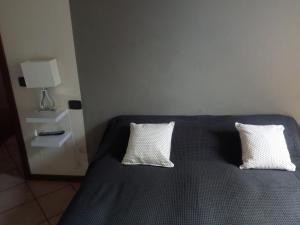 Posteľ alebo postele v izbe v ubytovaní Appartamento Luisa