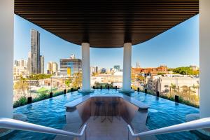 a view from the lobby of a building with a pool at FV by Peppers in Brisbane
