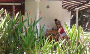 a man and a woman sitting at a table at Bird Villa in Galle
