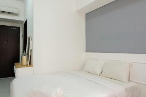 Ένα ή περισσότερα κρεβάτια σε δωμάτιο στο Best Price Studio at Casa De Parco Apartment By Travelio +12 φωτογραφίες