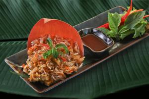 a plate of food with a bowl of rice at Anantara Bophut Koh Samui Resort in Bophut