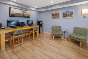 a waiting room with a desk and two chairs at Hotel Nexus; BW Signature Collection in Seattle