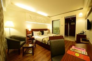 TV a/nebo společenská místnost v ubytování Hotel Regent Grand
