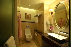 
a bathroom with a sink, toilet and shower at The Pllazio Hotel in Gurgaon

