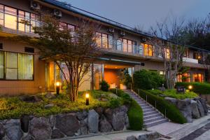 a building with a staircase in front of it at Tsumugi in Hakone